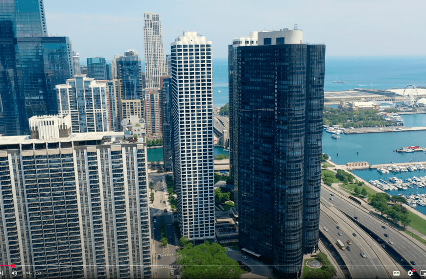 Aerial drone view of North Harbor Tower in Chicago, featuring luxury high-rise architecture along the Lake Michigan shoreline