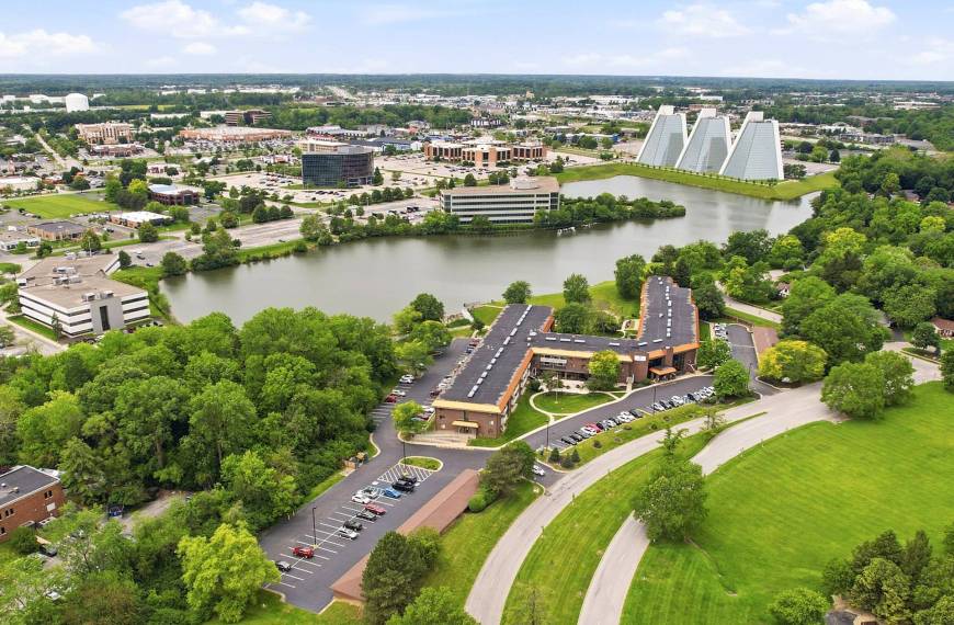 Drone view of King's Reserve College Park beside the lake with the College Park business district in Indianapolis, Indiana