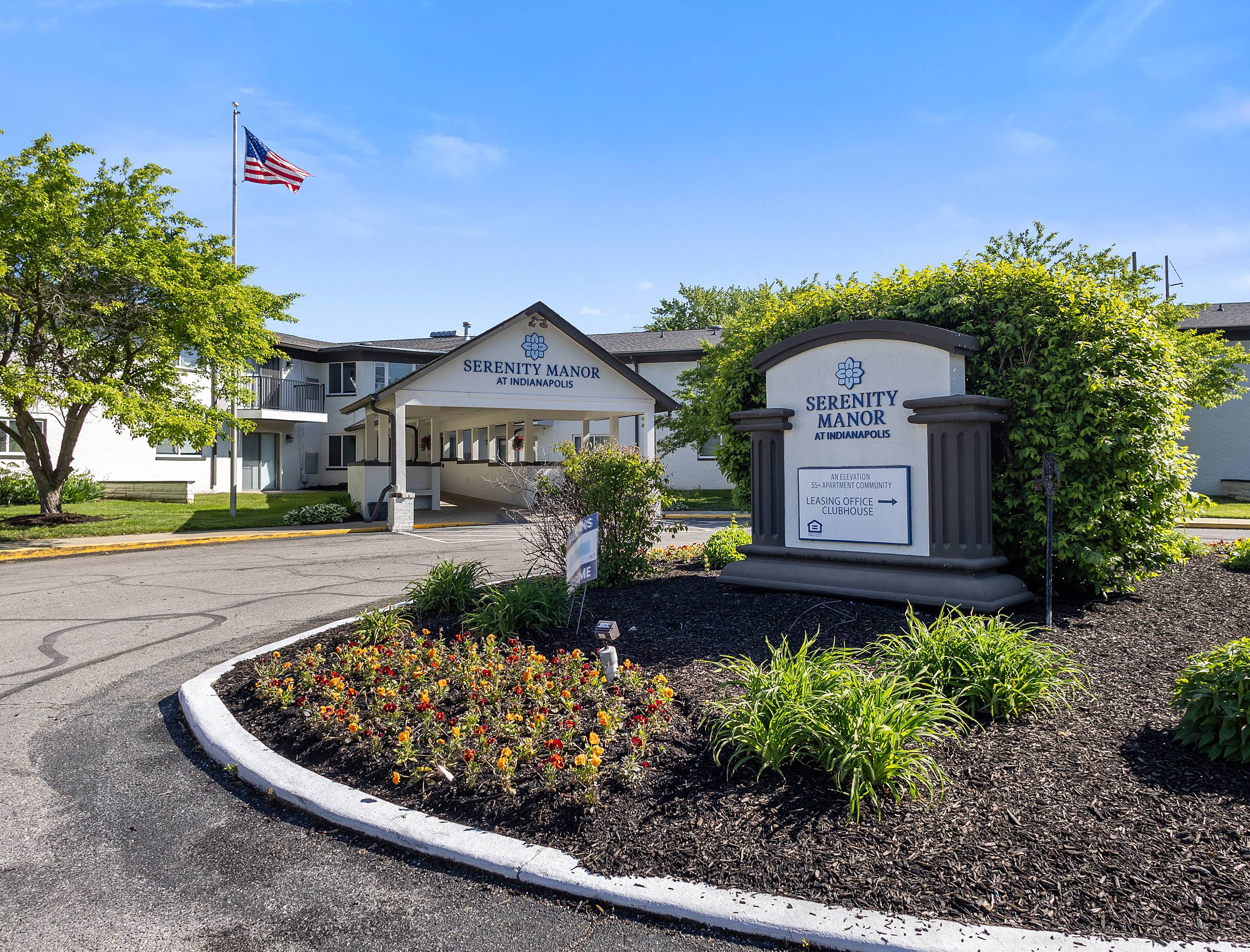 Serenity Manor at Indianapolis monument sign and landscaped entry drive in Indianapolis, Indiana